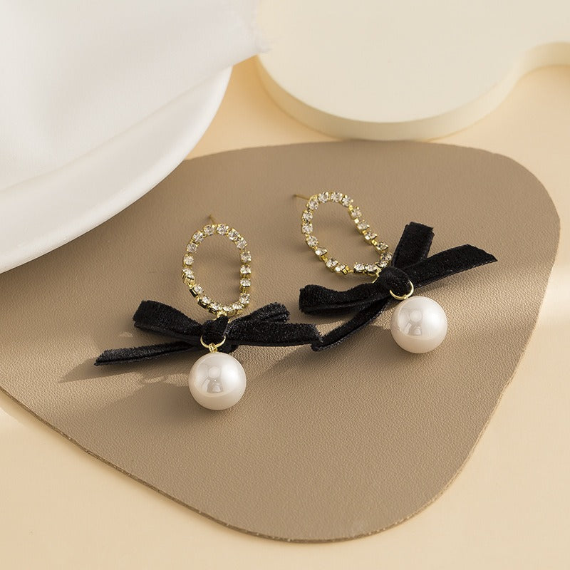 Black bow pearl long earrings