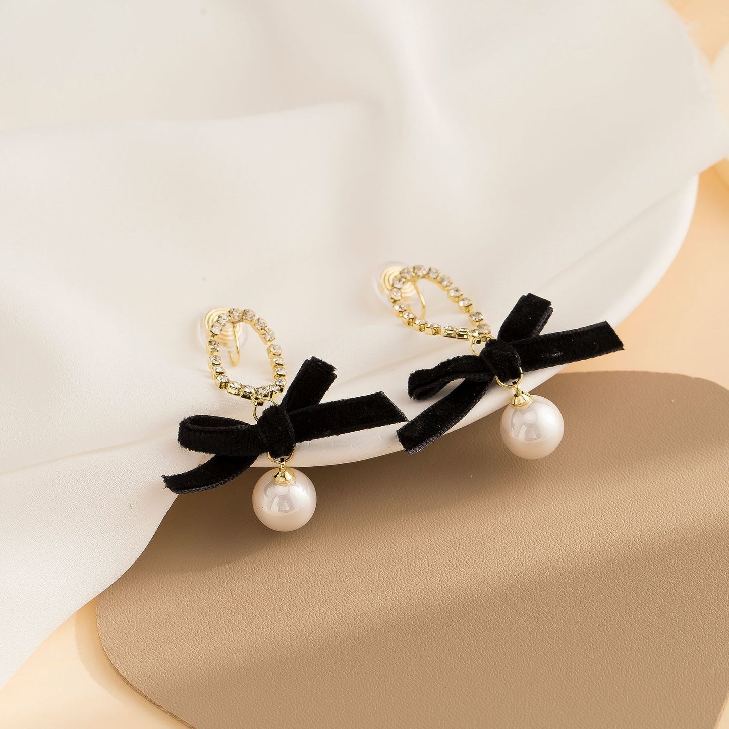 Black bow pearl long earrings