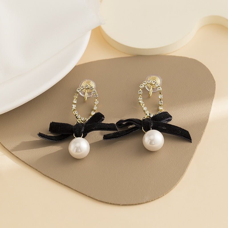 Black bow pearl long earrings