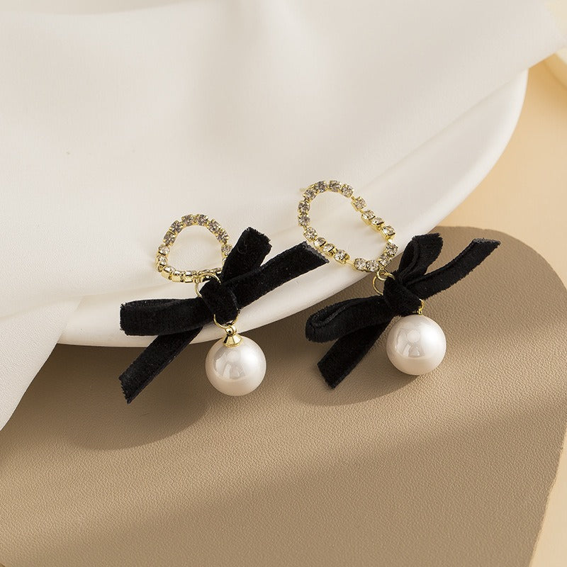 Black bow pearl long earrings